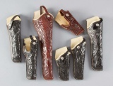 Collection of seven tooled Muckleroy leather Holsters, mostly unused condition, for a 14