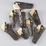 Collection of eight highly tooled Muckleroy leather Holsters, mostly unused condition, for a Ruger 6