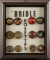 Framed collection of vintage, glass Bridle Rosettes, totaling 12.  This same type rosettes were used