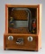 A vintage, 1 cent, coin-op, three ball, Kick Machine, in wooden case with glass front, manufactured
