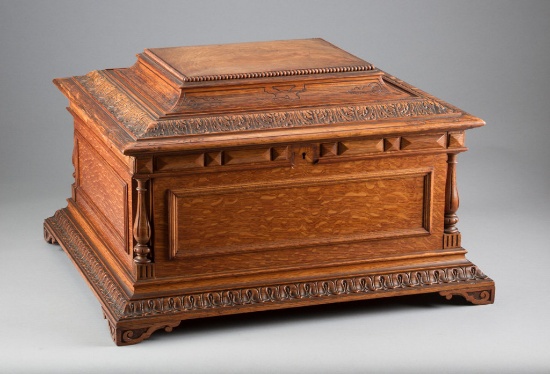 An exceptional 15 1/2" Regina, No.10 Duplex Music Box in elaborate carved oak case with carved pillo