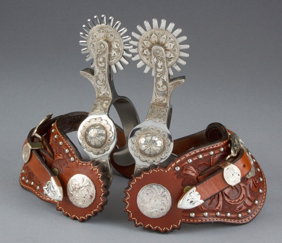 Fancy pair of Crockett marked single mounted Spurs with silver engraved overlay, raised concho on he