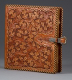 Fantastic carved leather Binder by noted artist, the late Bob Dellis, (1928-2002), 12