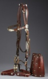 This lot consists of the following three items:  A pair of vintage spotted Roping Cuffs;  A Headstal