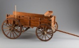 Miniature wooden Wagon, complete with seat and wooden tongue, wagon measures 22