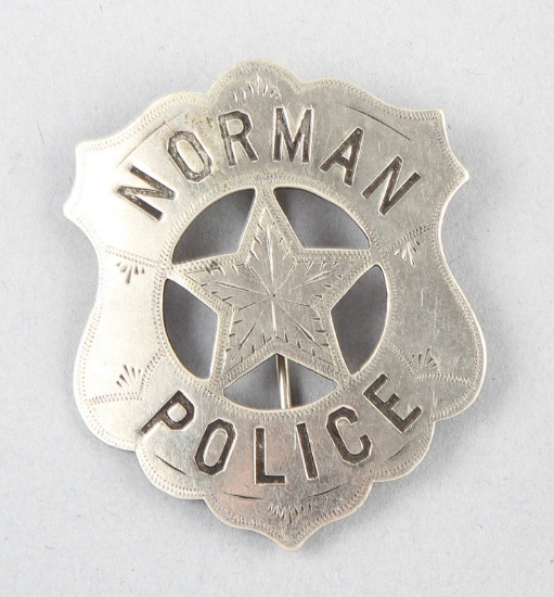 Norman, Oklahoma Police Badge, shield with cut out 5-point star, 2 1/8" tall, hallmark "C.D. Reese,