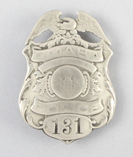 Omaha Police #131 Badge, shield shape with full eagle crest, 3" tall, showing much wear.  George Jac
