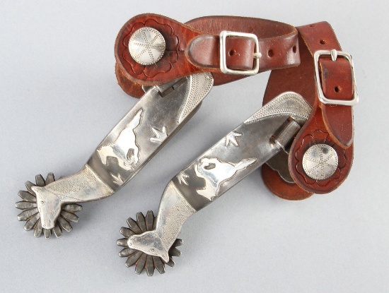 A pair of "Ray Anderson" marked, single mounted, silver overlay & engraved Spurs, #728, with silver