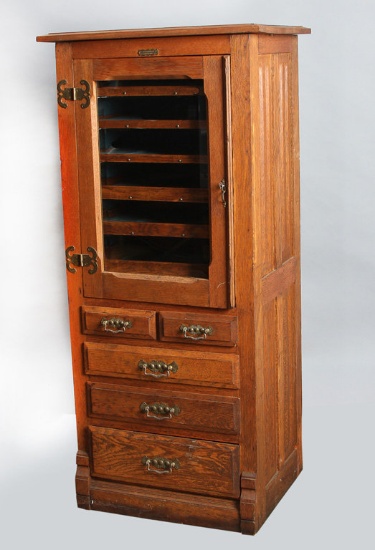 Antique, oak Dental Cabinet with plaque "The Harvard Co., Canton, Ohio", measures 54 1/2" T x 25" W