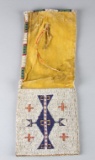 Plains Indian beaded Pipe Bag, possibly Kiowa, circa 19th century.  Upper section has sinew sewn bea