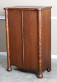 Antique quarter sawn oak, double doored Music Stand in original finish, circa 1900.  Stand is 49 3/4