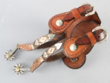 A pair of single mounted Spurs made by the late Carl Hall, with unusual grasshopper shanks, heart an