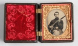 1/9 Plate Tintype of Civil War Infantryman in frock coat with light colored, trimmed cuffs holding h