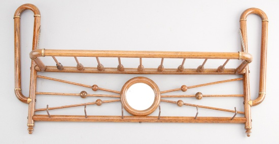 Antique oak stick and ball hanging Hat and Coat Rack, circa 1900, with unusual round beveled mirror