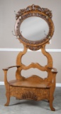 Beautiful, antique quarter sawn oak, lift seat Hall Tree with ornate carved oval beveled mirror and