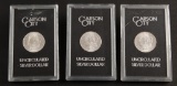 Group of three uncirculated Carson City Silver Dollars, one is dated 1883, two are dated 1884.  Thes