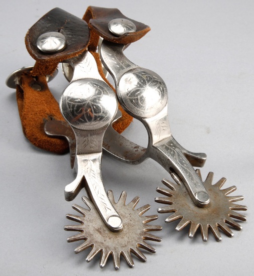 Pair of "Crockett" marked, single mounted Spurs done in the Parade Pattern, mounted with a pair of v