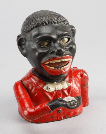 Antique cast iron, mechanical Coin Bank titled on back "Jolly Nigger Bank, Patent 1883", sold by "Sh