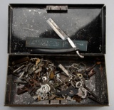 Metal Box  consisting of rings of antique Keys and one 