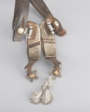 This  consists of two pair of Spurs:  (1) Unmarked single mounted Spurs with silver overlay and home