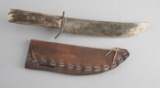 Large, bone handled Skinning Knife in leather Sheath, blade is 10 1/4