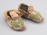 Pair of child's doeskin and beaded Moccasins, circa 1900, beads appear to be in good shape, showing