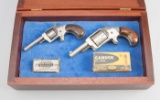 Wooden box containing two small Single Action Revolvers.  (1) Defender 88, 5-shot Revolver, .32 LONG