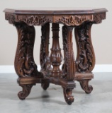Incredible highly carved octagon shaped Parlor Table, circa 1915-1920, with beautiful banded inlaid