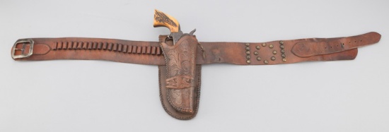 Vintage, single loop Holster for a 5 1/2" Colt single action revolver, accompanied by a 3" cartridge