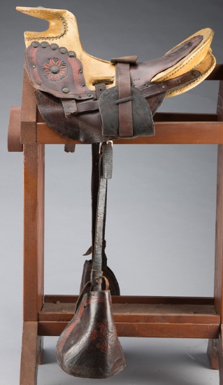 Early Mexican Saddle with rawhide wrapped seat and horn, leather skirt and leather wrapped wooden st