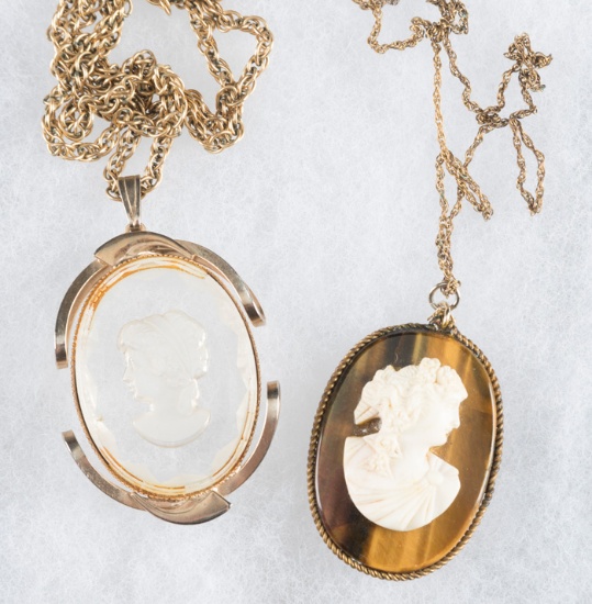 This  consists of two Cameos with necklace.  One is a 2" oval, one is 1 3/4" oval, both are hand car