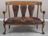 Fancy antique, quarter sawn oak Love Seat, circa 1910, in excellent finish and condition has lion he