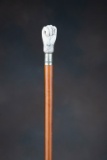 Antique Cane with steel spear point, and carved fist shaped handle with English hallmarks, also has