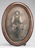 Very desirable oval, bubble glass framed vintage Photograph of an early cowboy in all his gear, circ