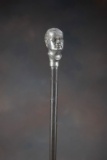 Vintage metal Advertising Cane with bust of a man as pommel, marked 