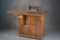 Outstanding antique, Singer Sewing Machine in quality quarter sawn oak cabinet, unique push button,