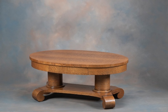 Antique, oval quarter sawn oak Coffee Table, circa 1915, with hide away drawered skirt and massive c