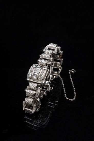 A ladies Platinum Watch with a diamond cover and diamond bracelet which holds 4.00 carats total weig