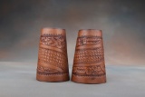 A pair of vintage leather Roping Cuffs, floral tooled with basket weave center.  Cuffs have inside l