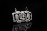 An 18 Kt. White gold, vintage Pendant / Pin which holds 4 carats total weight in round and baguette
