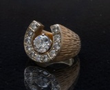 A Gents 14 Kt. Two tone gold, diamond horseshoe Ring which holds 11 / .10 carat round diamonds.  The