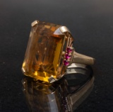 A 14 Kt. Yellow gold, Emerald cut citrine Ring with a 21 x 16 citrine in the center flanked by three