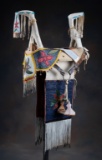 Three piece Set to include: Plateau Beaded Saddle, Martingale and Drapes.  A rare traditional 2 horn
