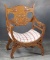 Ornate antique oak, bow bottom Fire Side Chair, circa 1900, with heavy carved back and front, 35 1/2