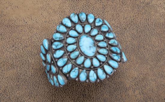 Silver Cuff with 61 polished turquoise stones, artist marked "ST", measures 3" tall.  LEO BRADSHAW C
