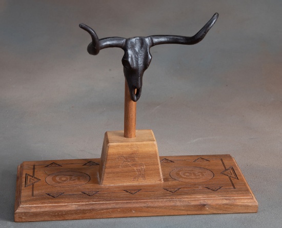 Two piece, Colt marked, wooden Pistol Stand with bronze Steer Head holder, measures 10" wide x 5" de
