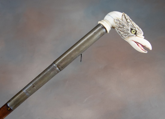 Antique Day's Patent Cane Gun with early carved elephant ivory Eagle Head handle and glass eyes, cir