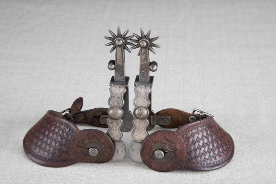 Fine pair of early "Star" marked, hand forged steel, August Buermann, engraved silver mounted Spurs