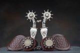 Exceptional pair of double mounted hand engraved Spurs attributed to August Buermann, star marked an