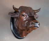 Very desirable vintage, porcelain hanging Bull Head with glass eyes, will extend from the wall 8